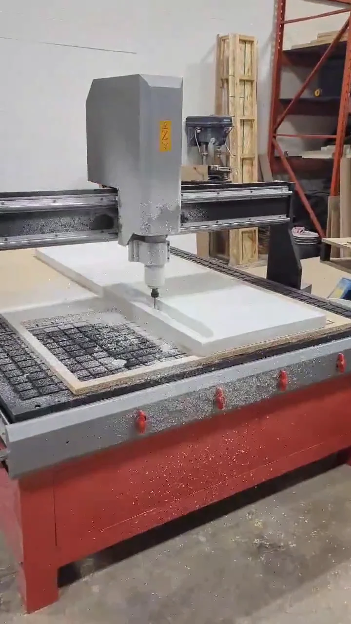 Still from the workshop video showing a CNC router machining a white side-skirt mold