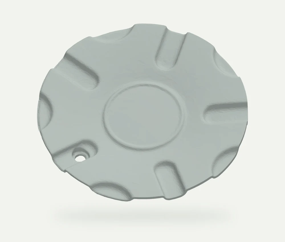 Model render of a scalloped replacement Jaguar wheel centre cap with a recessed round centre