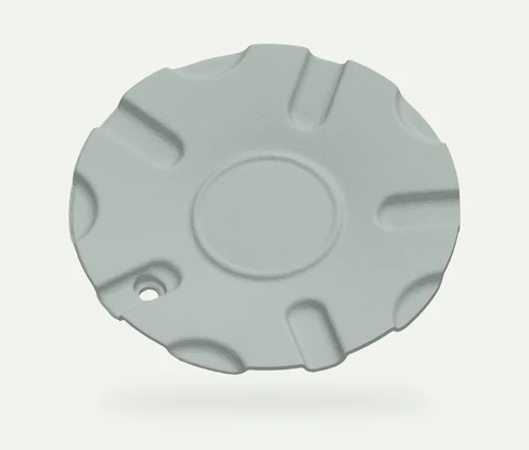 Model render of a scalloped replacement Jaguar wheel centre cap with a recessed round centre