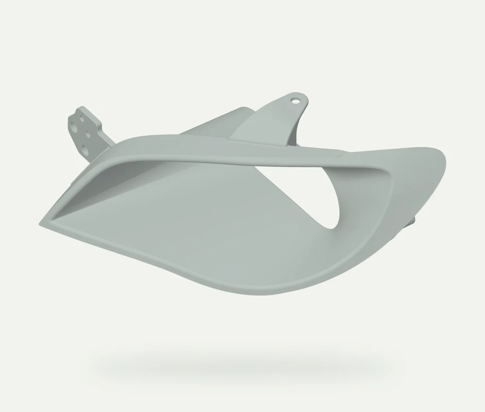 Light grey model render showing the wide shaped front inlet of a Subaru STI headlight intake duct and its mounting tabs